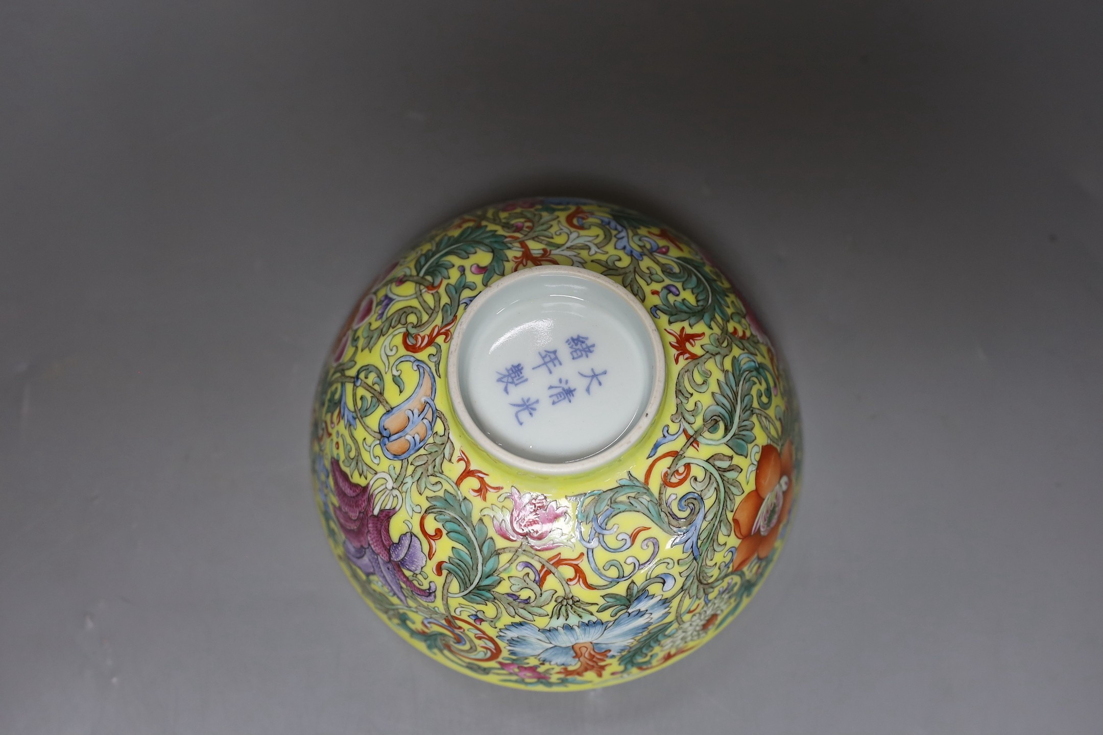 A Chinese yellow ground famille rose floral bowl, 15cm